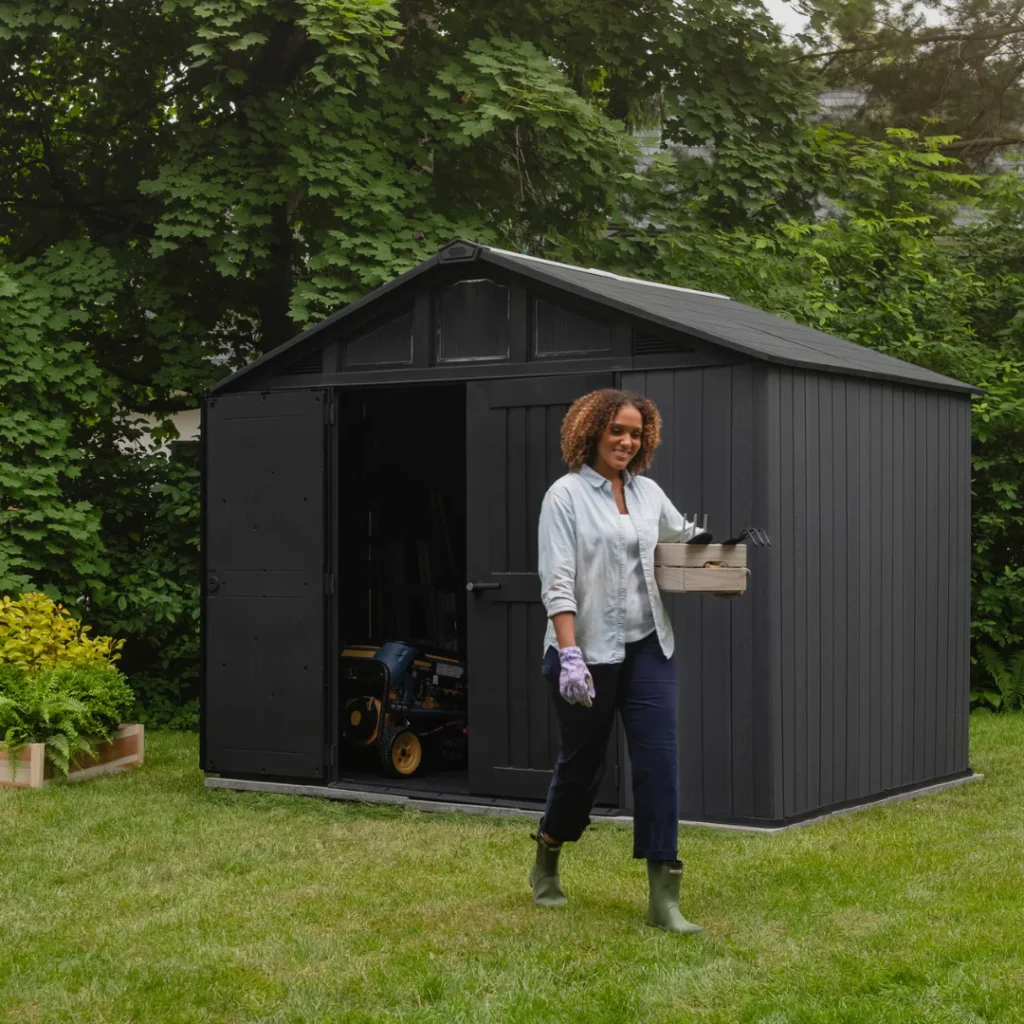 Person walking out of a Keter Stronghold shed
